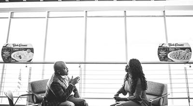 Daymond John providing Charlynda Scales, CEO of Mutt’s Sauce and a 2017 winner of Heroes to CEOs, advice on how to continue the success of her business with the grant she received from Bob Evans Farms.