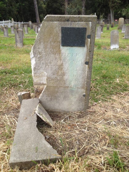 A crumbling headstone marks the grave of a U.S. Veteran at the Mare Island Naval Cemetery.