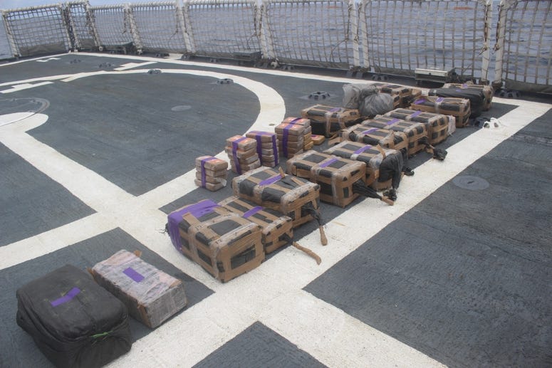 Bales of cocaine seized from a suspected smuggling vessel lie on the deck of the U.S. Coast Guard Cutter Valiant in September. 12,000 pounds of cocaine, worth over $165 million, intercepted by Coast Guard.