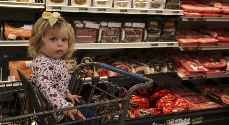 Quinn Prosper, daughter of Jina Prosper, Combat Center patron, attends the reopening of the Combat Center’s Commissary, Oct. 21, 2017. The command and DeCA worked diligently to restore the facility to the standards the patrons expect and deserve.