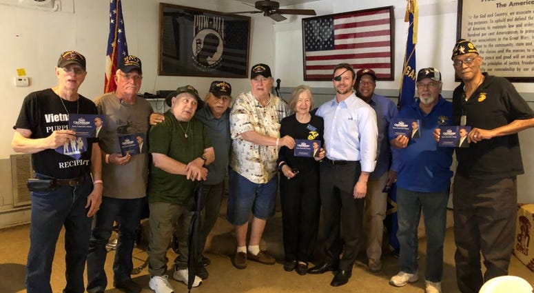 Retired SEAL Dan Crenshaw (wearing eyepatch) meets with members of American Legion Post 560. Crenshaw is in a runoff for for the Republican nomination in Texas 2nd District.