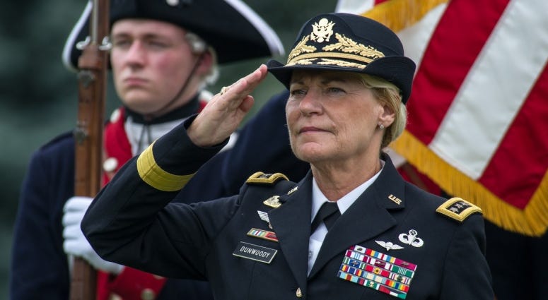 U.S. Army Gen. Ann E. Dunwoody, former commanding general of the Army Materiel Command, salutes during the playing of the national anthem at her retirement ceremony on Joint Base Myer-Henderson Hall, Va., Aug. 15, 2012.