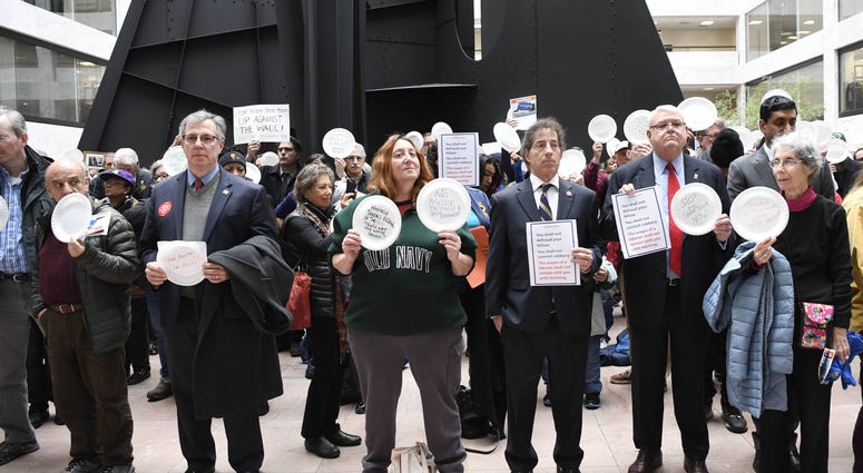 Union members, federal workers and other demonstrators protest the partial U.S. government shutdown on day 33 of the shutdown in the Hart Senate office building in Washington D.C.