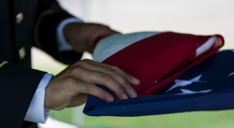 Sgt. 1st Class Andrew Martinez, an observer/coach trainer assigned to 4th Cavalry Multi-Functional Training Brigade, folds the United States burial flag during a military funeral honors ceremony Sept. 18, 2018, in Louisville, Ky. Soldiers from 4th Cav MFT