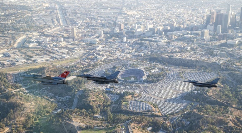 Three F-16 Fighting Falcons from Edwards AFB fly past Dodger Stadium after the ceremonial flyover at the beginning of game two of the 2017 World Series between the Los Angeles Dodgers and Houston Astros Oct. 25.