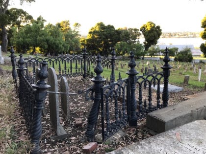 A bent and twisted Victorian-era fence on the Mare Island Naval Cemetery.