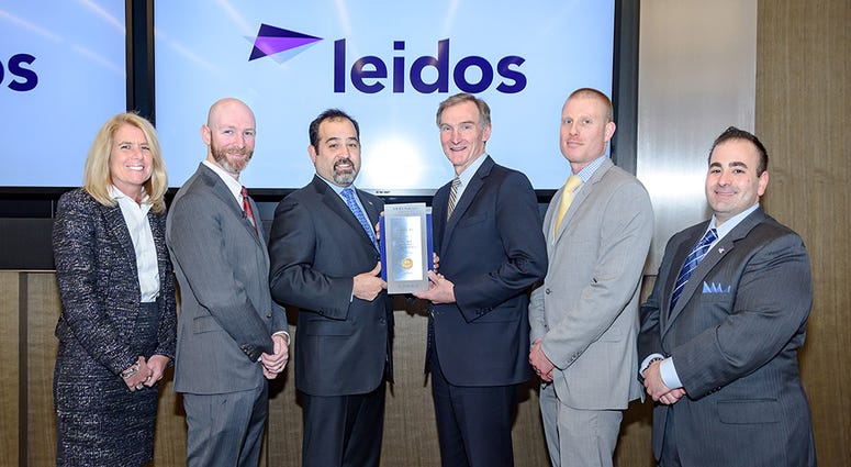 Leidos, a top veteran employer, is presented an award by Military Times and Vets Indexes Vets Indexes and Military Times present an award to Leidos for being a top vet employer