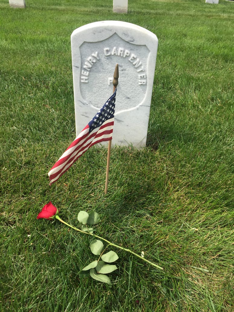 A flower placed by a Memorial Day Flowers volunteer at Arlington National Cemetery Memorial Day Flowers volunteers place flowers on the graves of veterans
