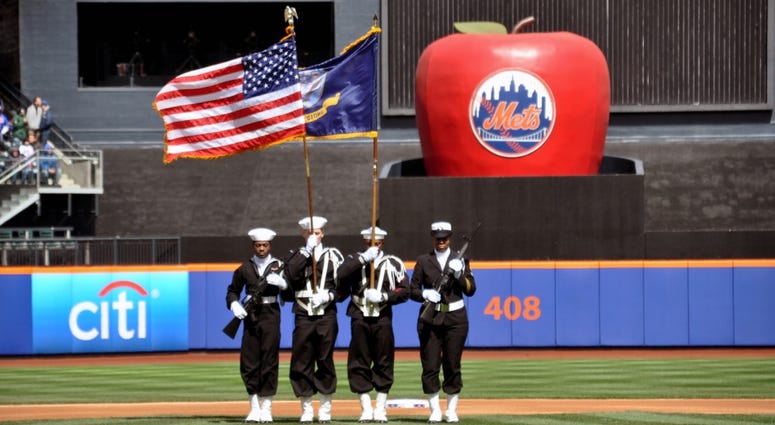 The Navy Operational Support Center (NOSC) New York City color guard present the colors prior to the New York Mets opening day game at Citi Field, March 31, 2014