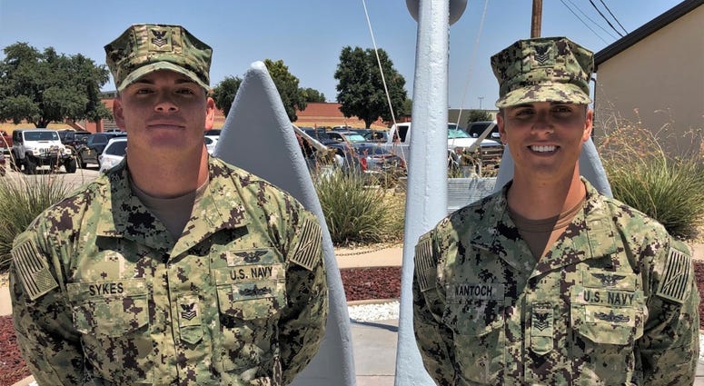 Aviation Boatswain's Mate (Handling) 1st Class Cody Sykes (left) and Aviation Boatswain's Mate (Handling) 1st Class Matthew Wantoch, were praised and credited for saving the life of a local civilian during a boating accident.