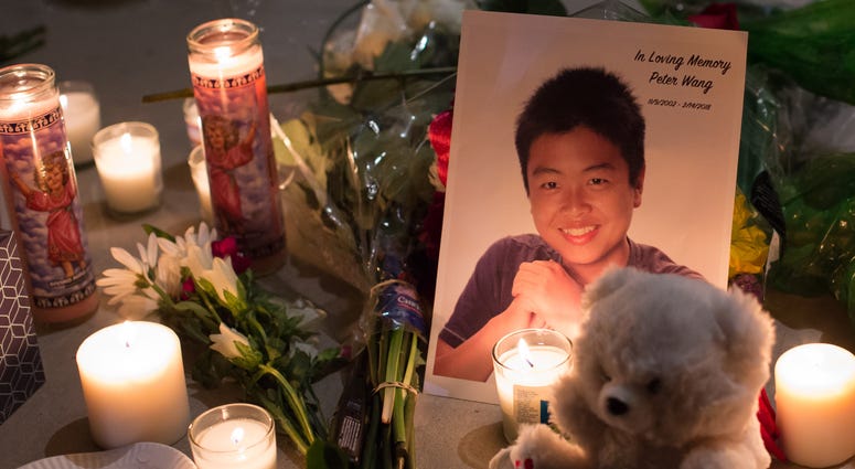 Family members of the late Peter Wang attend the vigil honoring the 17 lives lost at the school shooting in Parkland, Florida. peter wang