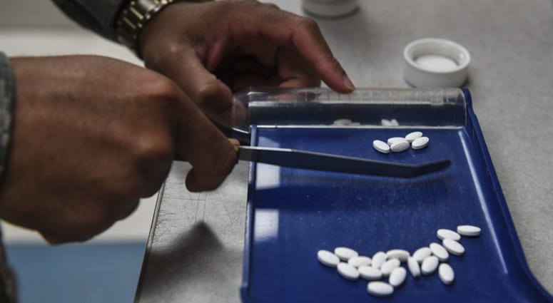 U.S. Air Force Senior Airman Joseph Jarrett, a pharmacy technician with the 1st Special Operations Medical Support Squadron, separates and counts prescription medicine at Hurlburt Field, Fla., May 30, 2018.
