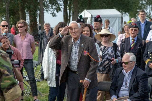 Gene Metcalfe, a World War II veteran and former POW, salutes the crowd after being awarded the Military Order of William in Groesbeek, Netherlands, Gene Metcalfe, a World War II veteran and former POW, salutes the crowd after being awarded the Military Order of William in Groesbeek, Netherlands,