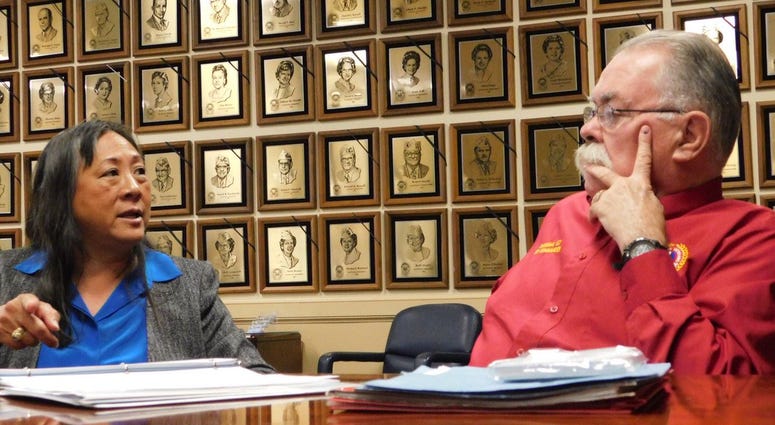 Newly elected AMVETS National Commander Rege Riley speaks with retired Navy Rear Admiral Alma Grocki in 2017