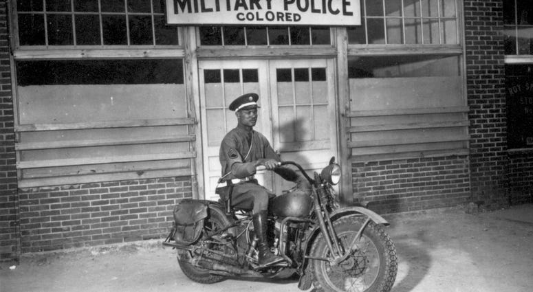 2. An MP on motorcycle stands ready to answer all calls around his area. Columbus, Georgia in 1942