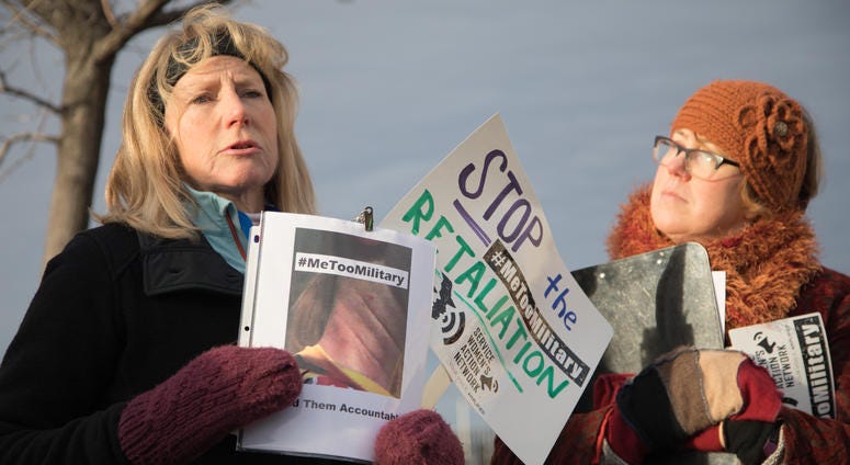Sue, an Air Force veteran, speaks at the #MeTooMilitary demonstration outside the Pentagon Monday morning as the CEO of the Service Women's Action Network, Lydia Watts, looks on. MeToo Protest at the Pentagon