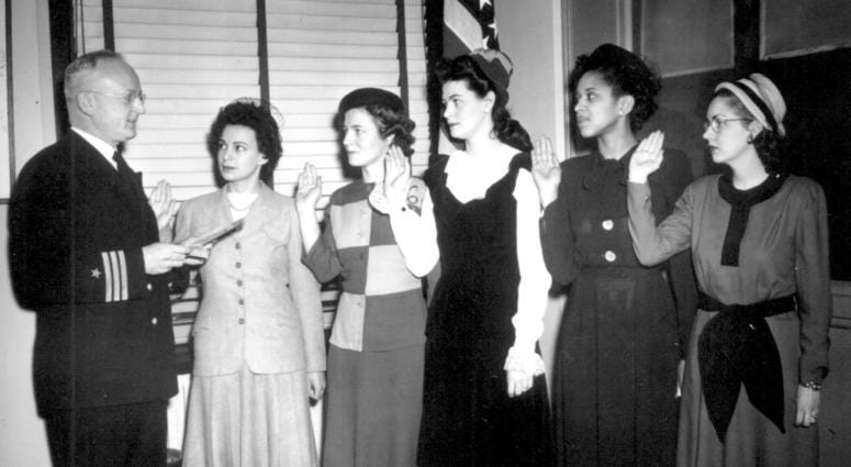 Cmdr. Thomas A. Gaylord, USN (Ret'd), administers oath to five new Navy nurses commissioned in New York. Phyllis Mae Dailey, the Navy's first African-American nurse, is second from the right. March 8, 1945