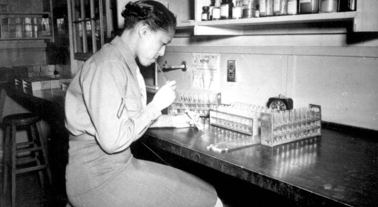 Pfc. Johnnie Mae Welton, Negro WAC, laboratory technician trainee, conducts an experiment in the serology laboratory sf the Fort Jackson Station Hospital, Fort Jackson, SC. March 20, 1944
