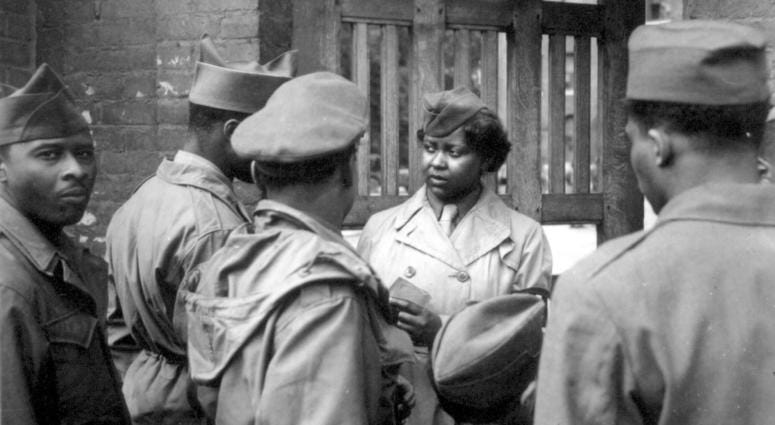 The first Negro WACs to arrive in Europe were 800 girls of the 6888th Central Postal Directory Bn. After the battalion had set up its facilities at Rouen, it held an open house, Pvt. Ruth L. James, is on duty at the gate. May 26, 1945