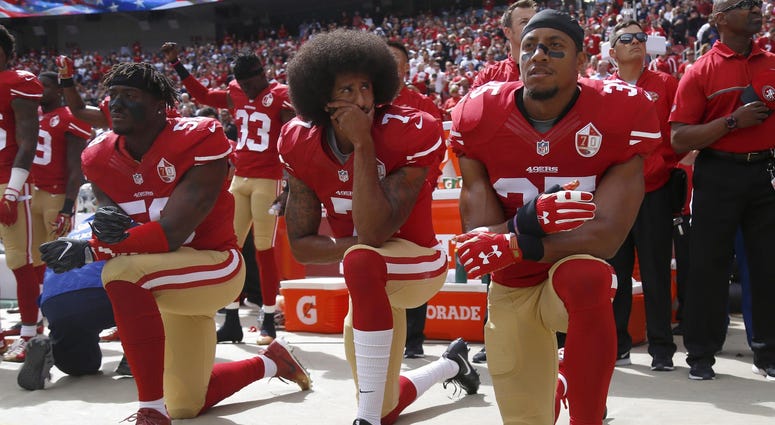 From left, The San Francisco 49ers' Eli Harold (58), Colin Kaepernick (7) and Eric Reid (35) kneel during the national anthem before their a game against the Dallas Cowboys on October 2, 2016, at Levi's Stadium in Santa Clara, Calif.