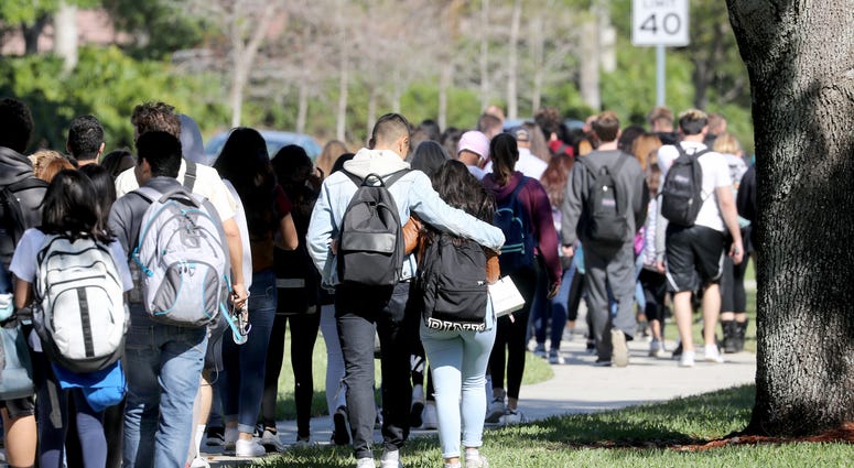 Marjory Stoneman Douglas High School students join the walkout protest in honor of the 17 victims killed at the school on Valentine's Day on March 14, 2018 in Parkland, Fla.