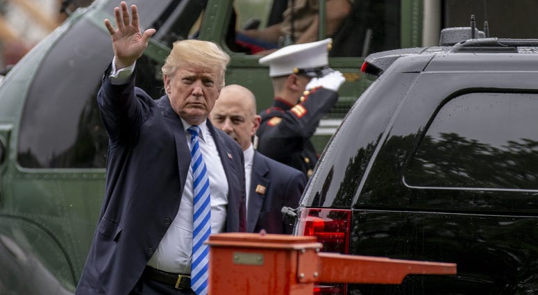 President Donald J. Trump exits Marine One and enters a waiting SUV as he visits first lady Melania Trump at Walter Reed Medical Center in Bethesda, Maryland on May 16, 2018.