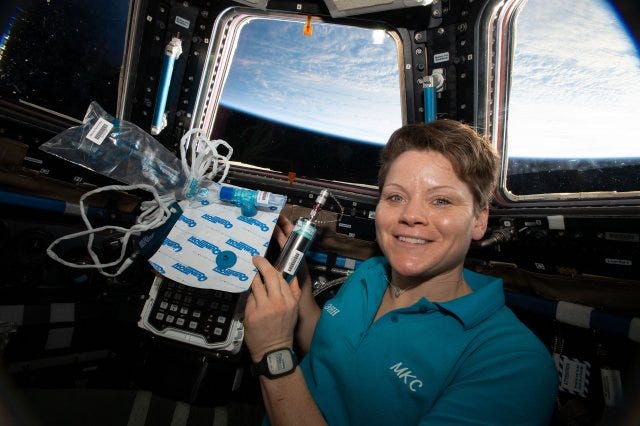 Astronaut Lt. Col. Anne McClain is pictured in the cupola holding biomedical gear for an experiment that measures fat changes in the bone marrow before and after exposure to microgravity. Army astronaut reflects on mission 250 miles above Earth
