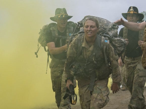 Sgt. Danielle Martin approaches the finish of a ruck march during the 1-134th Cavalry Squadron's spur ride during annual training in the Republic of Korea. Sgt. Danielle Martin approaches the finish of a ruck march during the 1-134th Cavalry Squadron's spur ride during annual training in the Republic of Korea