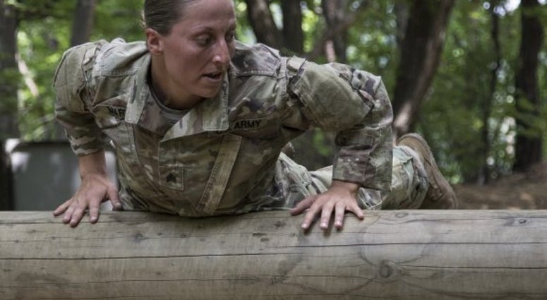 Sgt. Danielle Martin negotiates an obstacle during the 1-134th Cavalry Squadron's spur ride during annual training in the Republic of Korea Sgt. Danielle Martin negotiates an obstacle during the 1-134th Cavalry Squadron's spur ride during annual training in the Republic of Korea