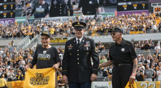 Theodore "Ted" Sikora, left, and Edward "Ed" Sikora, right. are honored by the Pittsburgh Steelers