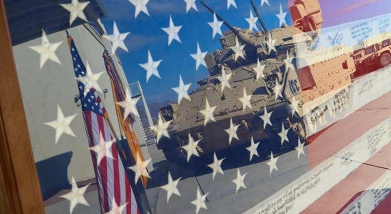 An encased flag is displayed during a ceremony held Sept. 11