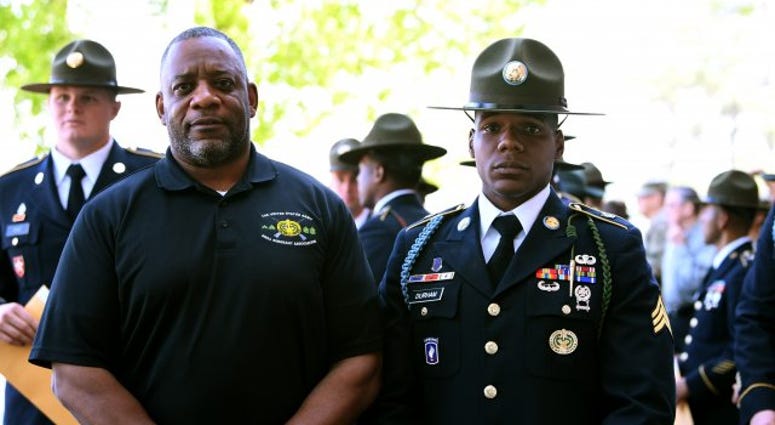 Retired Master Sgt. Dean Durham proudly stands with his son, Sgt. Donovan B. Durham Drill sergeant carries on a Family tradition