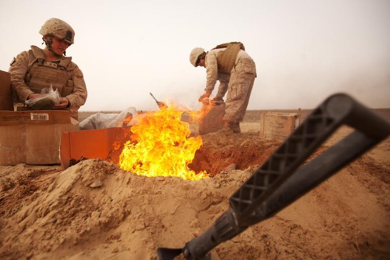 U.S. Marines dispose of trash in a burn pit in 2012 in Afghanistan. BurnPits1