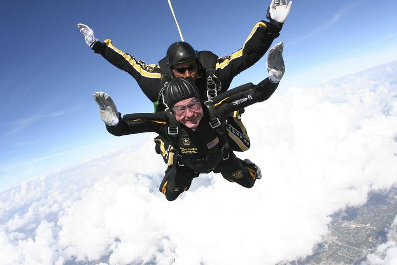 Former President George H.W. Bush free falls as he makes a dramatic entrance to his presidential museum in College Station, Texas on Nov. 10, 2007.