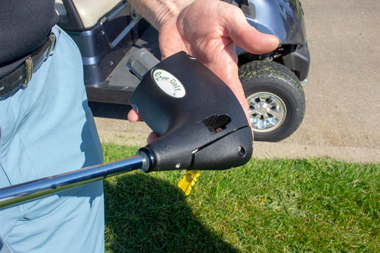 Some TEE Tournament golfers, unable to swing a club, use adaptive devices like this. The golfer angles the club behind the ball, then fires a powder cartridge that drives the ball across the course.