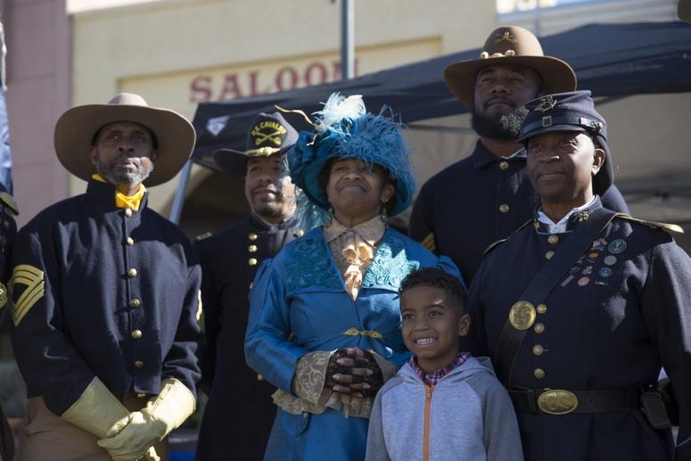Civilians with the Buffalo Soldiers of the Arizona Territory and Ladies and Gentlemen of the Regiment pose for a group photo during Yuma Military Appreciation Day in Downtown Historic Yuma on Feb. 16, 2019. BuffaloSoldiers