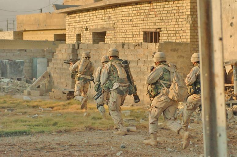 Soldiers from the 1st Infantry Divisions 3rd Brigade Reconnaissance Troop clear houses in Fallujah during Operation Al-Fajr Soldiers from the 1st Infantry Divisions 3rd Brigade Reconnaissance Troop clear houses in Fallujah during Operation Al-Fajr