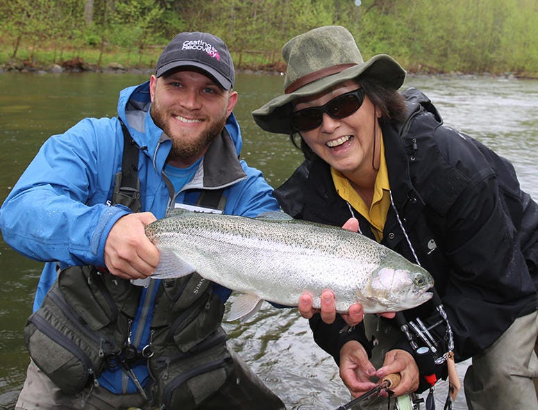 Lindsay Long fishing with a male fly fishing guide