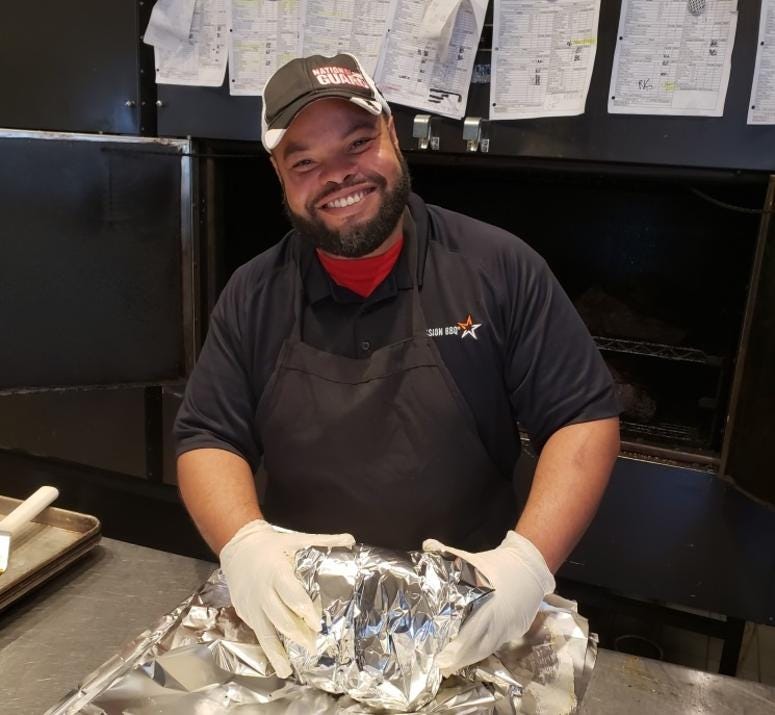 A veteran team member working at Mission BBQ's Oviedo, FL location.