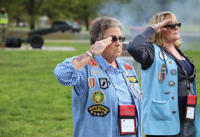 Army retired 1st Sgt. Nikki Hayhurst with Army veteran Norma Thelen salute during the retreat ceremony Apr. 26 at the U.S. Army Combined Arms Support Command 1st Logistical Command Memorial at Fort Lee, Virginia. Hayhurst, also a Vietnam veteran, Thelen a Vietnam Women Veterans visit Fort Lee