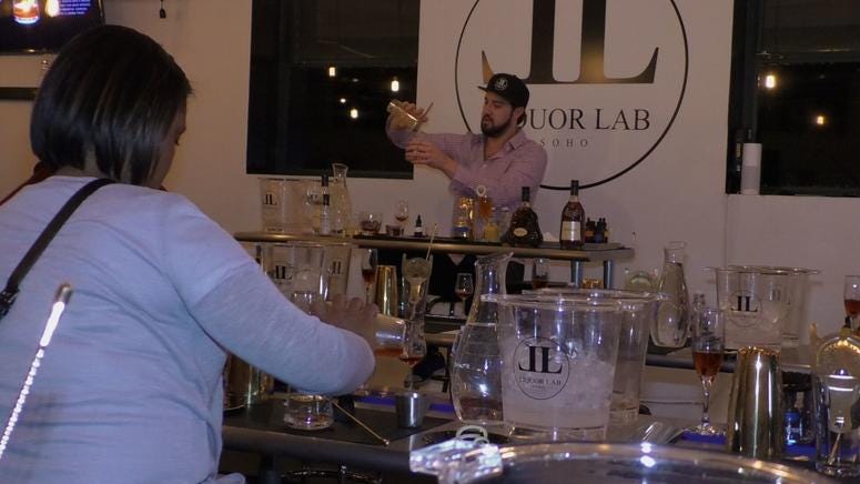 Liquor lab CEO Owen Meyer teaching a class to attendees in NYC.