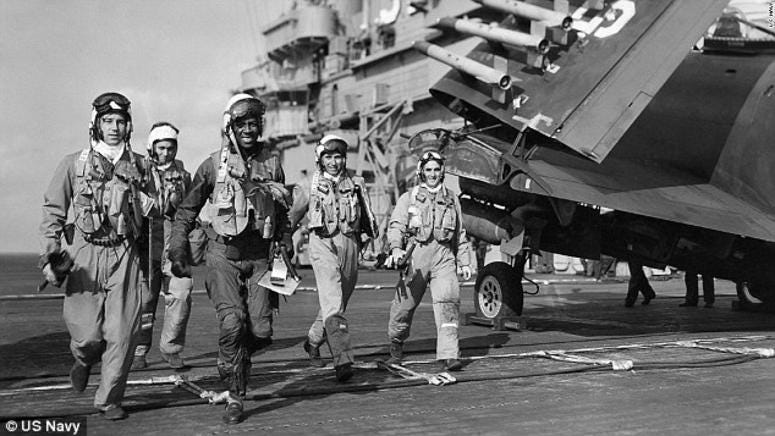 Brown, pictured with his crew on board USS Leyte