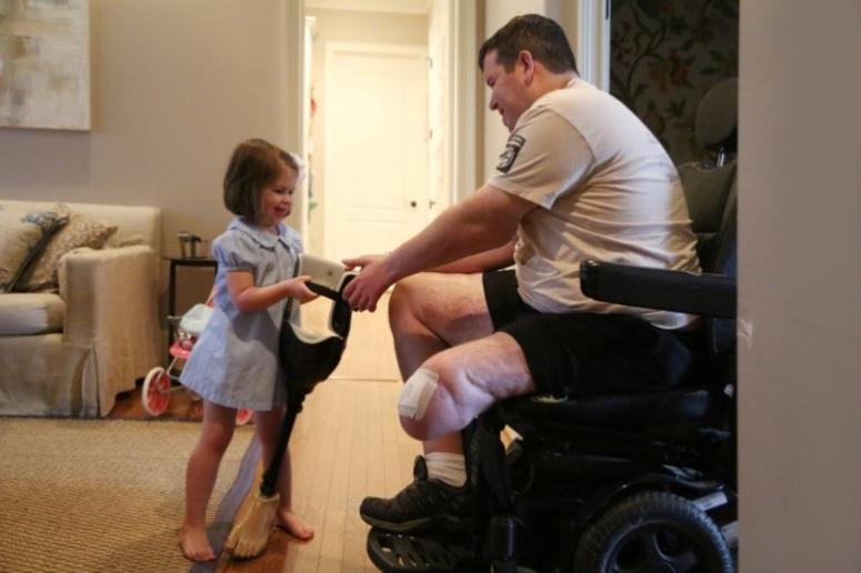 Kids are caregivers too: For Sarah and Michael’s daughters, helping their dad is a part of every day life. Kids are caregivers too: For Sarah and Michael’s daughters, helping their dad is a part of every day life.