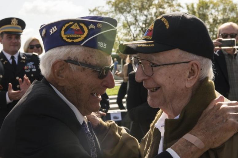 World War II veterans Joe Caserta and Clarence Smoyer embrace