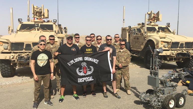 Lex McMahon (in hat) and Titan FC fighters visited the troops in Kuwait in 2016. Titan FC COO Lex McMahon and Titan FC Fighters visit with EOD troops on a 2016 visit to Kuwait