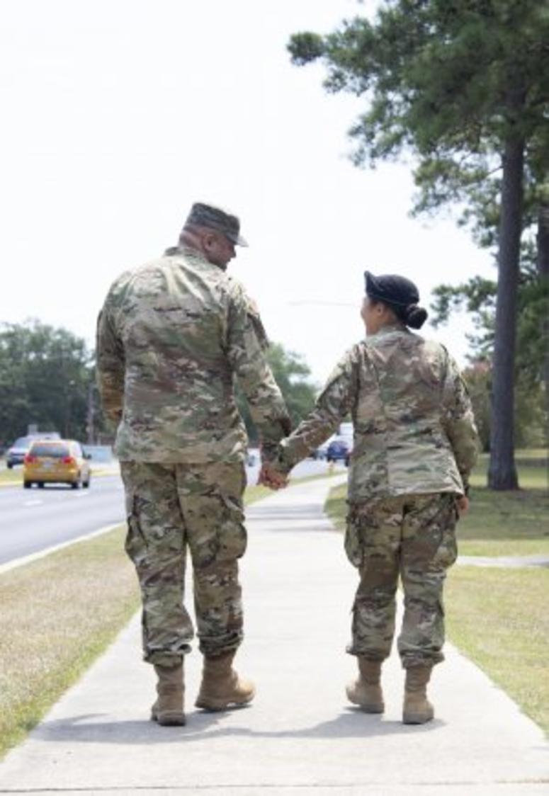 Staff Sgt. Joshua Mitchell, left, walks with his wife Spc. Eunjee Mitchell during the Fort Jackson Family Day on July 31. Spc. Mitchell recently graduated Basic Combat Training at the post.