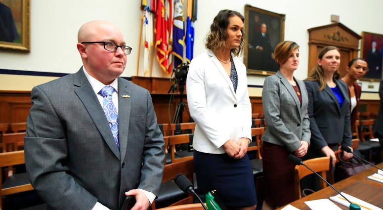 Transgender military members listen before the start of a House Armed Services Subcommittee on Military Personnel