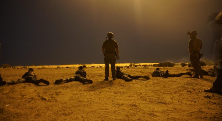 Nigerien army soldiers shoot targets under 60mm illumination mortar rounds as a part of Exercise Flintlock 2017 in Diffa, Niger, March 9, 2017. Nigerien army soldiers shoot targets under 60mm illumination mortar rounds as a part of Exercise Flintlock 2017 in Diffa, Niger, March 9, 2017.
