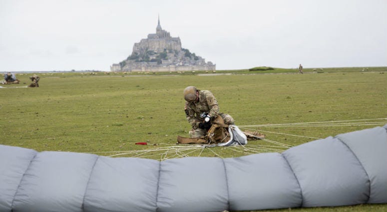 U.S Army Special Forces commemorate WWII with jump into Mont Saint-Michel, Normandy, France. U.S Army Special Forces commemorate WWII with jump into Mont Saint-Michel, Normandy, France.