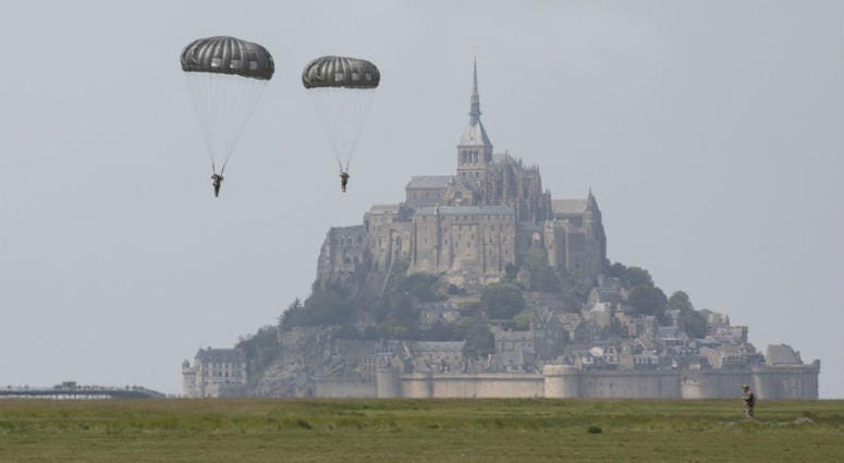 U.S Army Special Forces commemorate WWII with jump into Mont Saint-Michel, Normandy, France. U.S Army Special Forces commemorate WWII with jump into Mont Saint-Michel, Normandy, France.